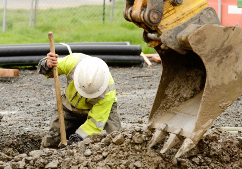 A man digging out a hole during excavation services in East Peoria IL